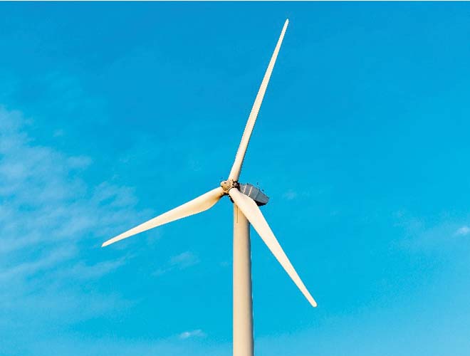 Wind turbines generating electricity alongside solar panels